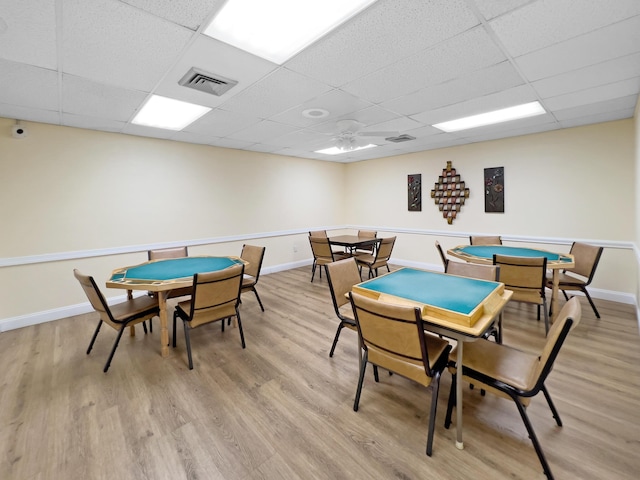 game room with light wood-style floors, visible vents, and baseboards