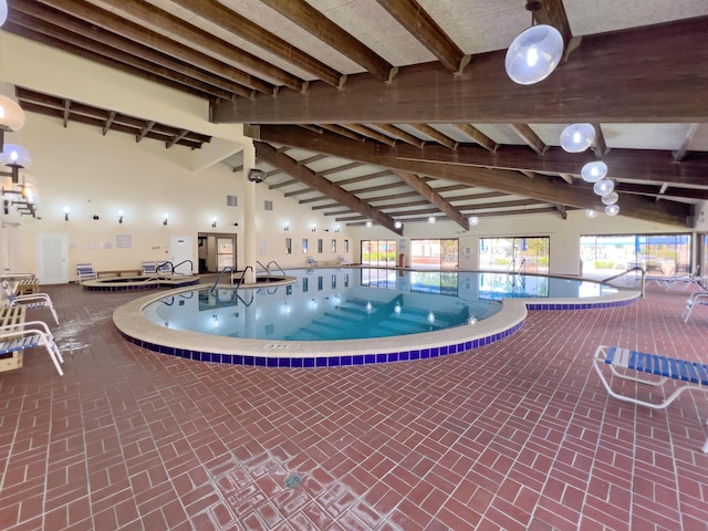 community pool with an indoor in ground hot tub