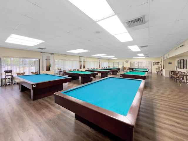 rec room with visible vents, wood finished floors, a paneled ceiling, and pool table