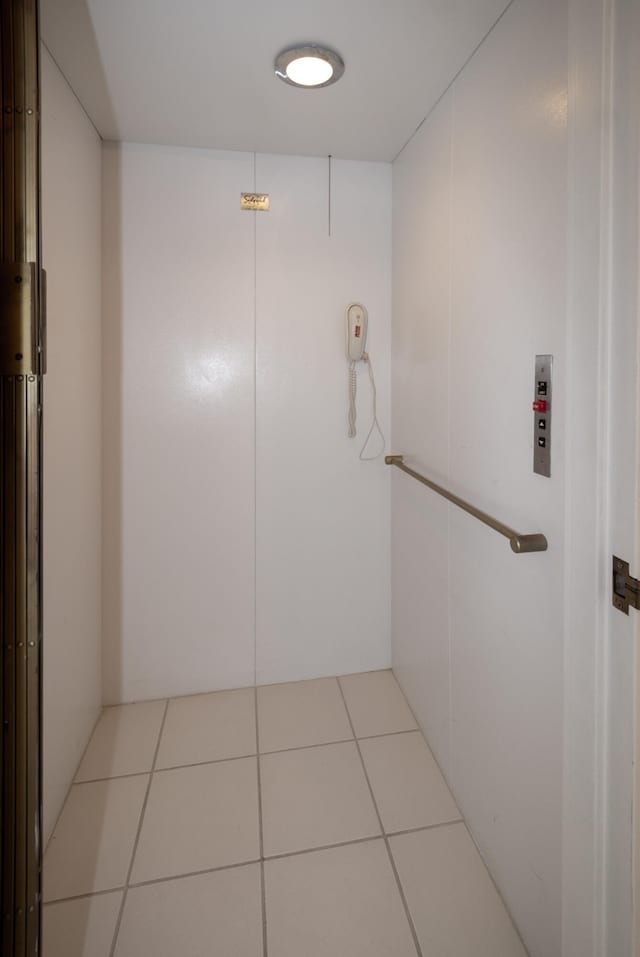 hallway with light tile flooring