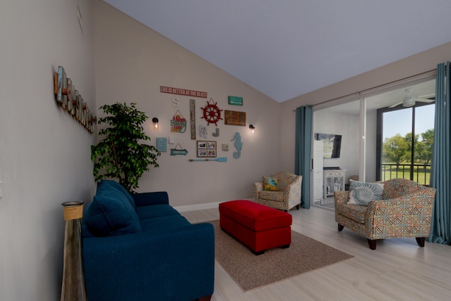 living room featuring high vaulted ceiling, light hardwood / wood-style flooring, and ceiling fan