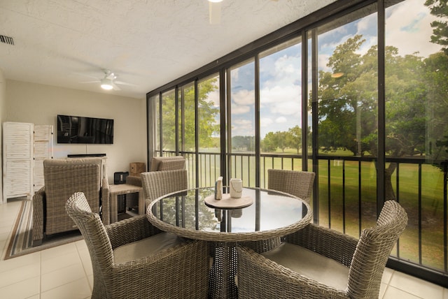 sunroom / solarium with ceiling fan