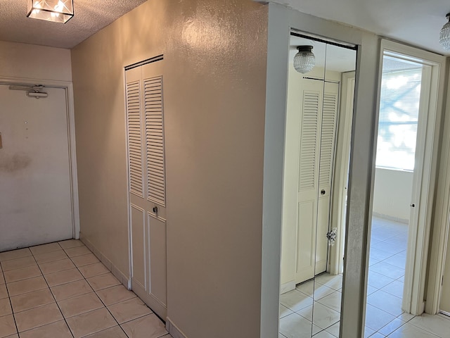 hallway featuring light tile flooring