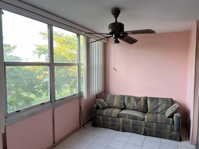 tiled living room featuring ceiling fan