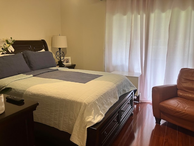 bedroom featuring dark hardwood / wood-style flooring