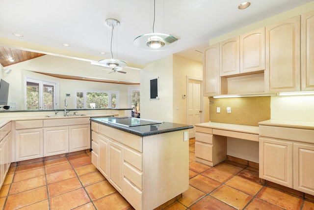 kitchen featuring sink, light tile floors, a kitchen island, tasteful backsplash, and ceiling fan