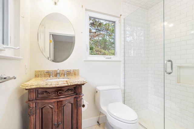 bathroom with walk in shower, vanity, toilet, and tile floors