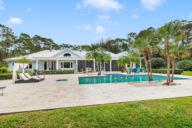 view of swimming pool featuring a patio area