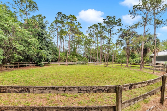 view of yard with a rural view