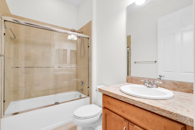 full bathroom featuring shower / bath combination with glass door, vanity, and toilet