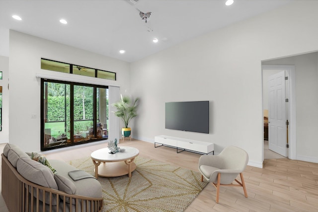 living room with light hardwood / wood-style flooring