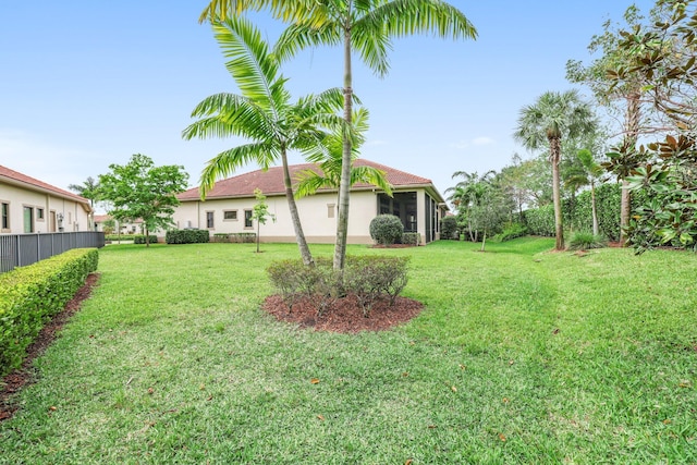 view of yard featuring a sunroom