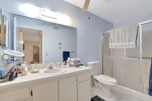 bathroom featuring ceiling fan, vanity with extensive cabinet space, walk in shower, toilet, and tile floors