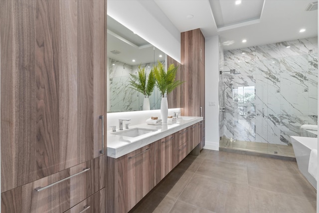 bathroom with vanity and separate shower and tub