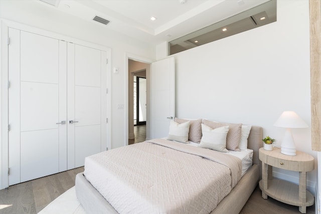 bedroom featuring a closet and light hardwood / wood-style flooring