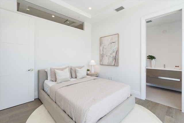 bedroom featuring wood-type flooring