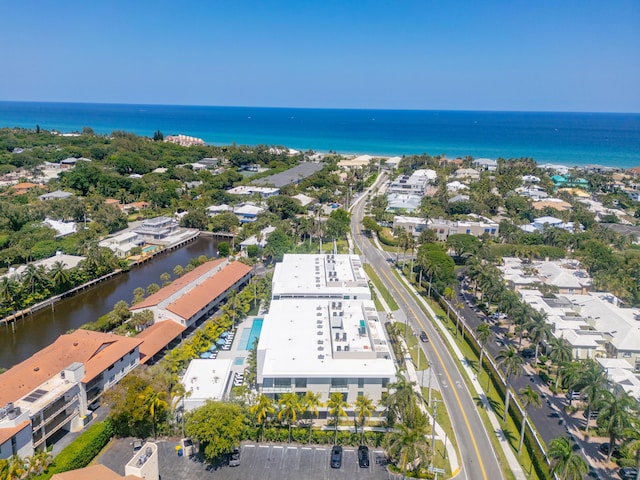 birds eye view of property featuring a water view