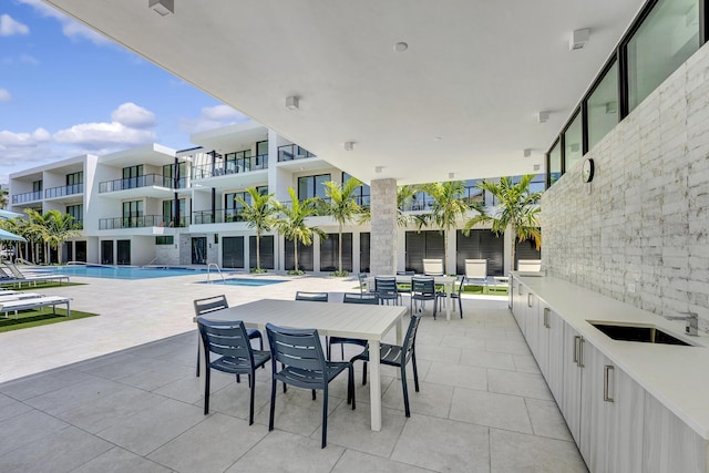 view of patio with a community pool