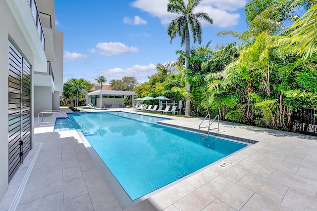 view of swimming pool featuring a patio area