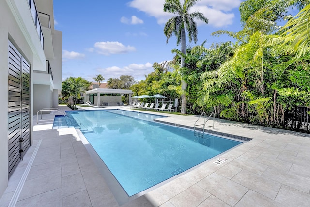 view of swimming pool featuring a patio