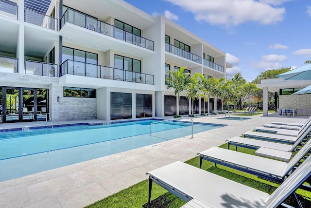 view of swimming pool with a patio area