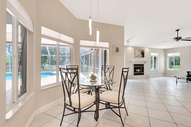 tiled dining area with ceiling fan