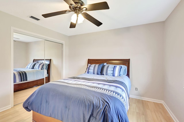 bedroom featuring a closet, ceiling fan, and light hardwood / wood-style floors