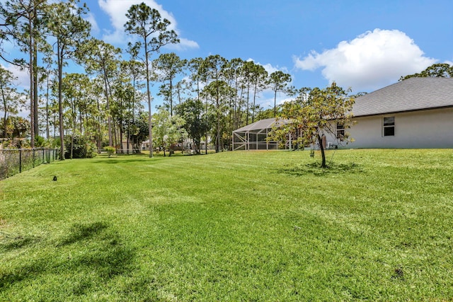 view of yard featuring a lanai