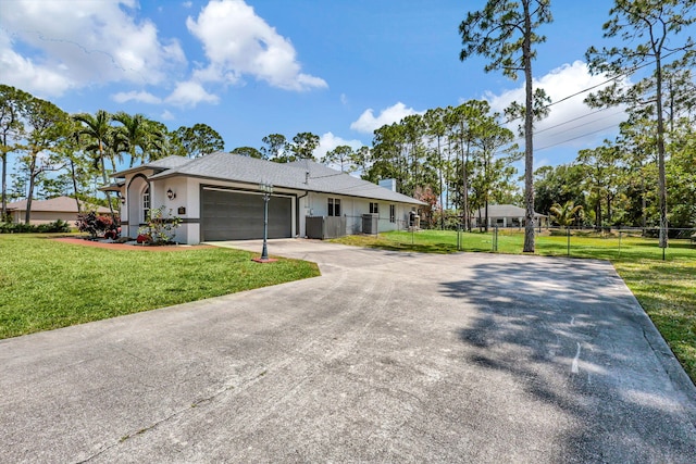 ranch-style house featuring a garage and a front yard