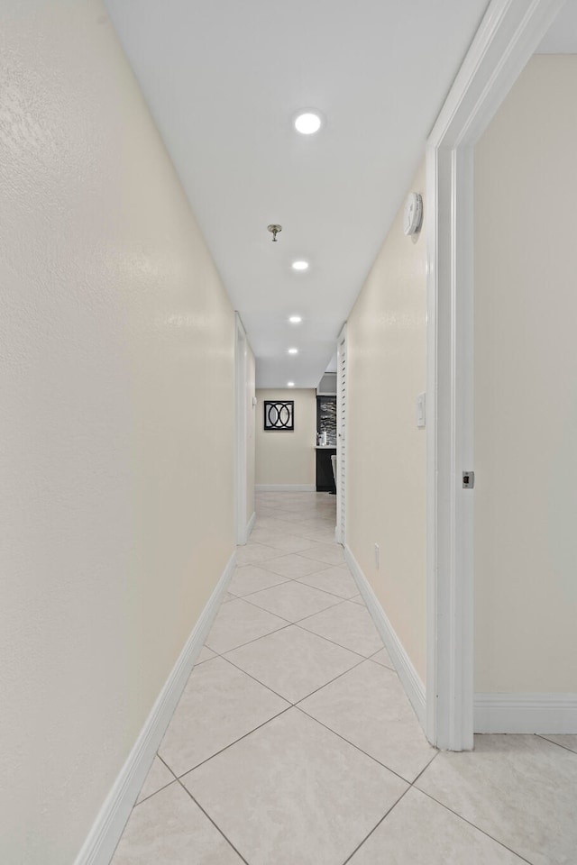 corridor with light tile floors