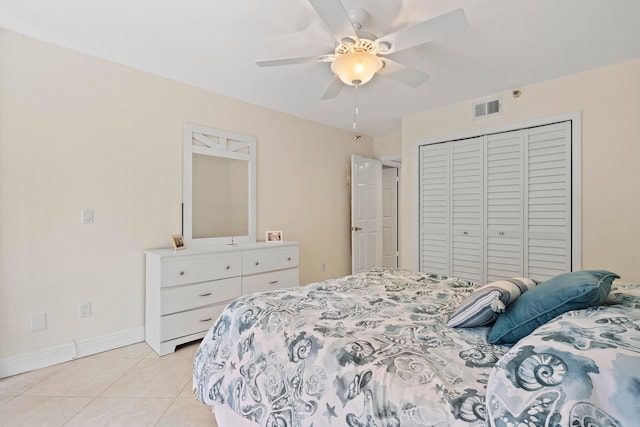 tiled bedroom featuring a closet and ceiling fan