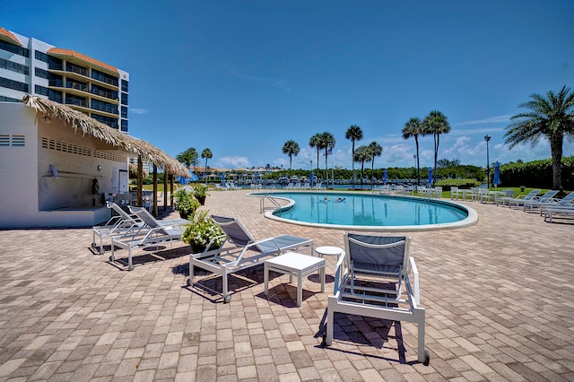 view of swimming pool featuring a patio area