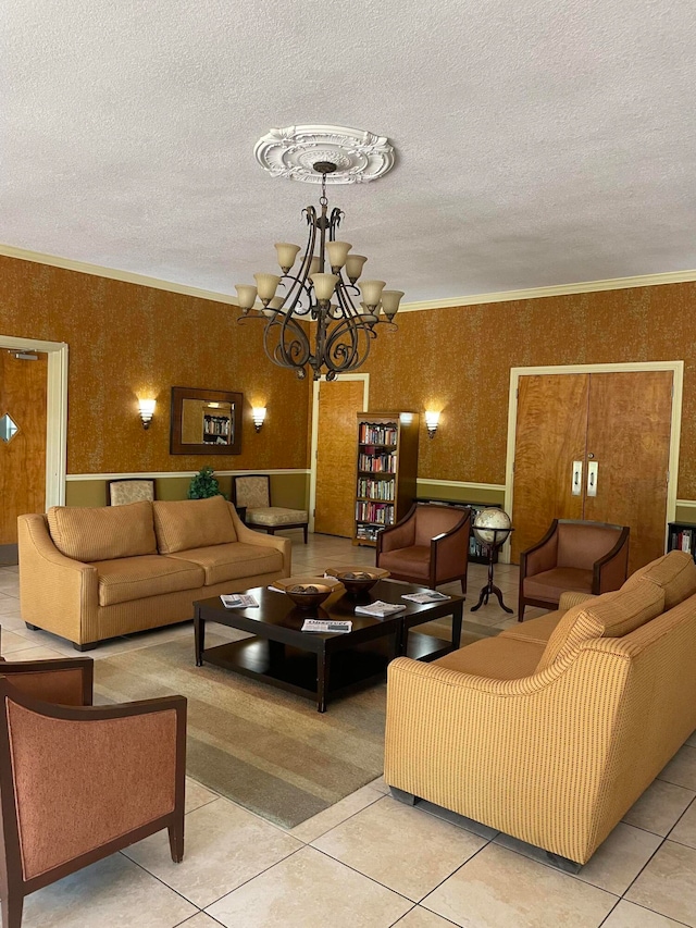 tiled living room with ornamental molding, a textured ceiling, and an inviting chandelier