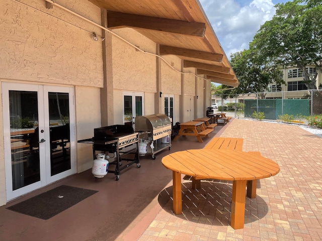 view of terrace with area for grilling and french doors