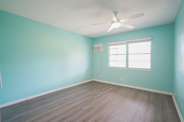 unfurnished room with a textured ceiling, ceiling fan, and dark hardwood / wood-style flooring