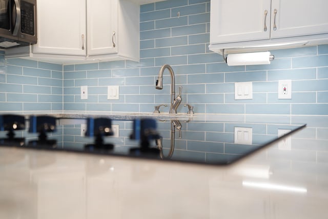 interior details featuring white cabinetry