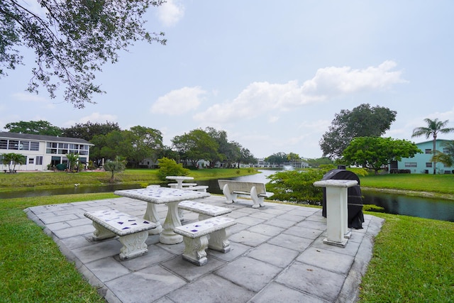 view of terrace featuring a water view