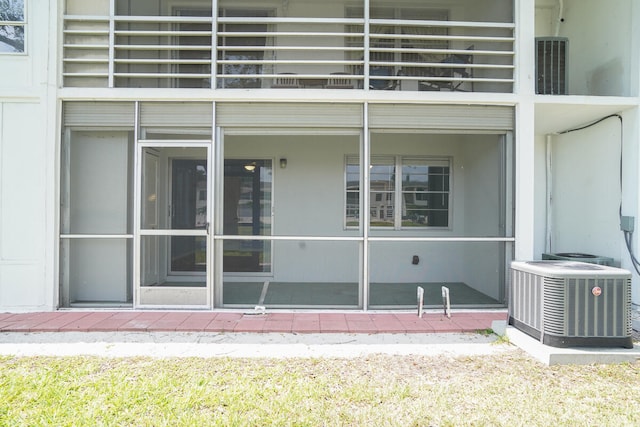 property entrance with a balcony and central AC