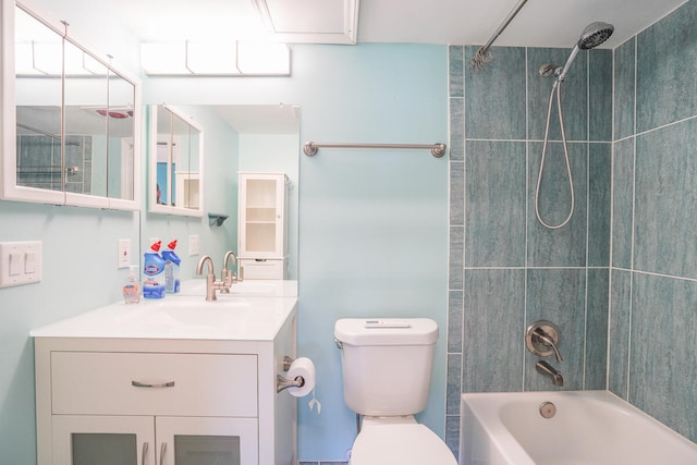 full bathroom featuring vanity, toilet, and tiled shower / bath combo