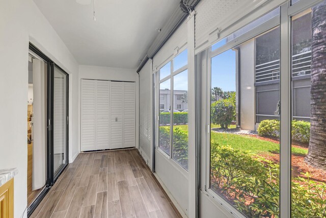 66 Capri B, Delray Beach, FL 33484 - unfurnished sunroom with wood finished floors