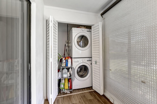 66 Capri B, Delray Beach, FL 33484 - laundry room with stacked washer and clothes dryer and wood finished floors