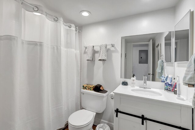 66 Capri B, Delray Beach, FL 33484 - full bath featuring vanity, toilet, electric panel, and a shower with curtain