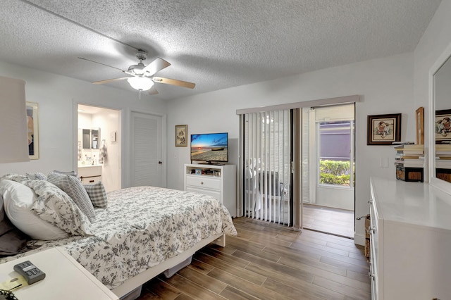 66 Capri B, Delray Beach, FL 33484 - bedroom featuring a textured ceiling, dark wood-style flooring, access to exterior, ceiling fan, and ensuite bathroom