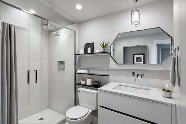 66 Capri B, Delray Beach, FL 33484 - full bathroom featuring a stall shower, toilet, vanity, and recessed lighting