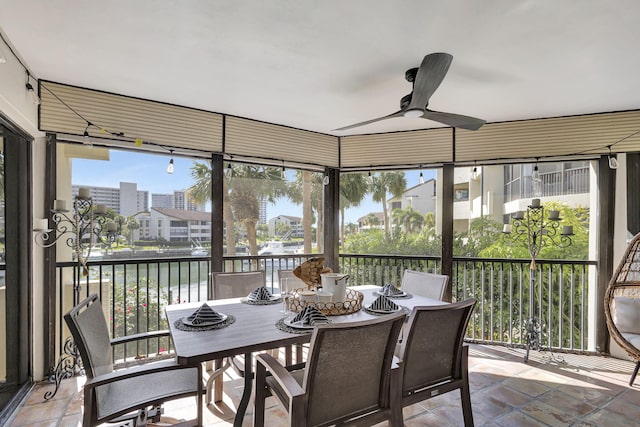 sunroom with plenty of natural light and ceiling fan