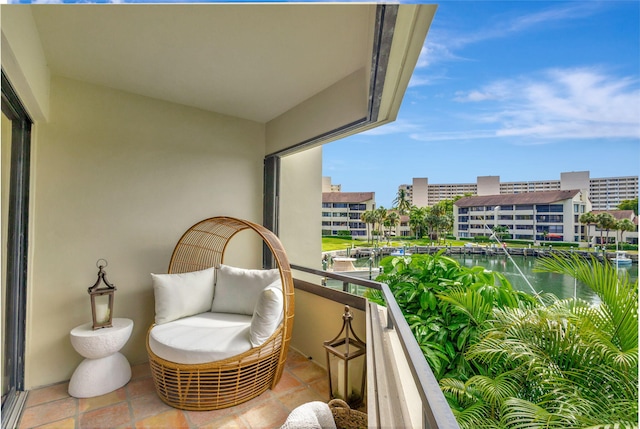 balcony featuring a water view