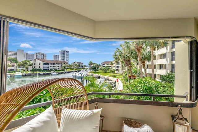 balcony featuring a water view