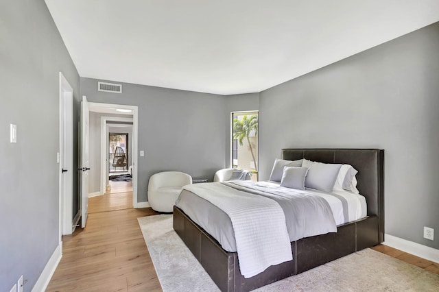 bedroom with light hardwood / wood-style flooring