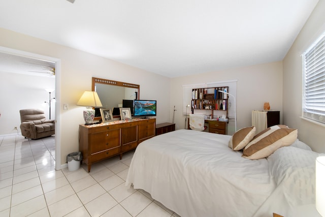 bedroom featuring light tile flooring and radiator