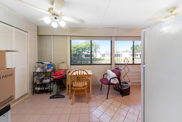 recreation room featuring ceiling fan and light tile floors